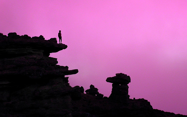 Silhouette of rocks and a person