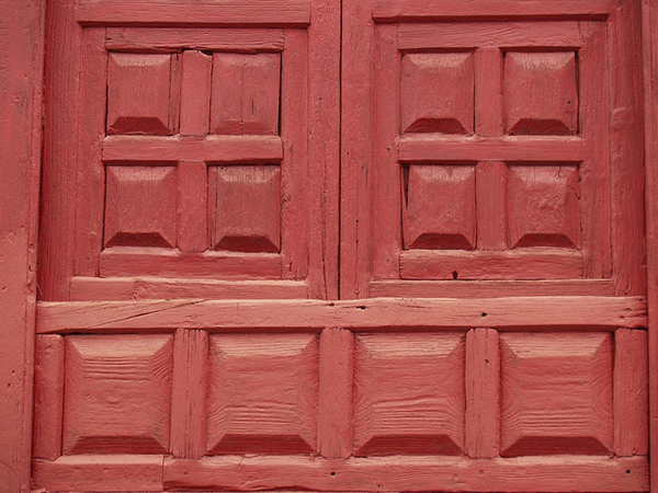 Close up of a red wooden door