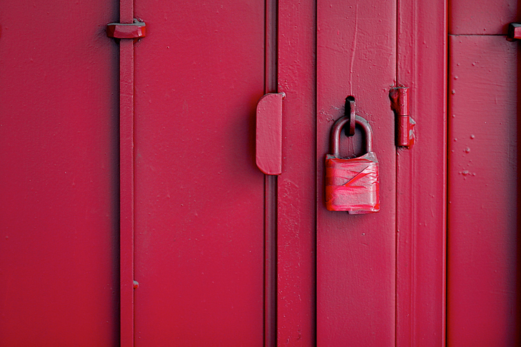 Red door with padlock