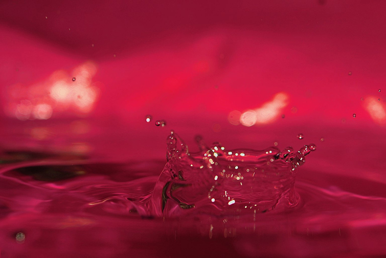 Water splash with red background