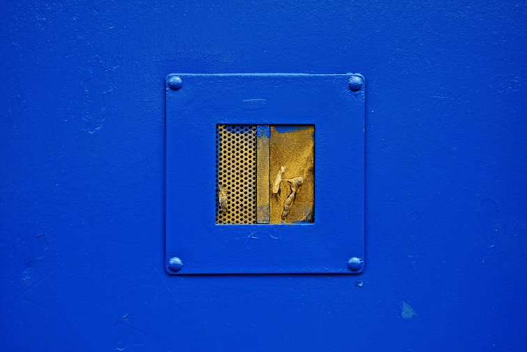 Gold insert in a blue door