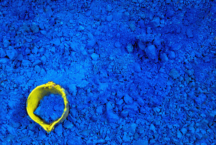 yellow object in blue powder