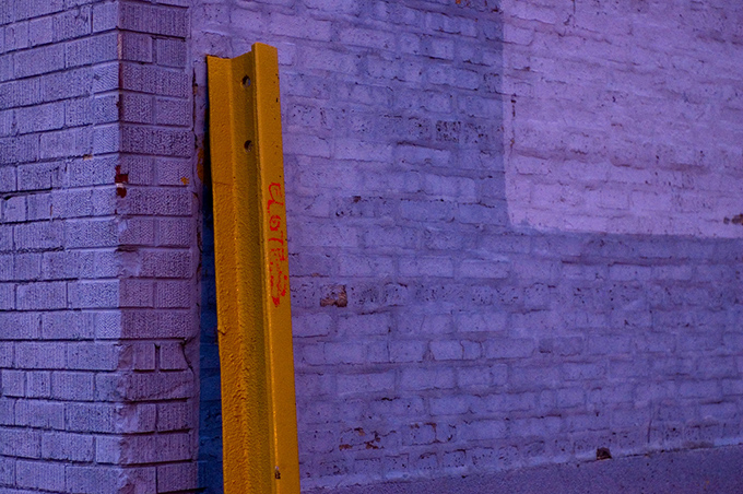 Railway track against a purple wall