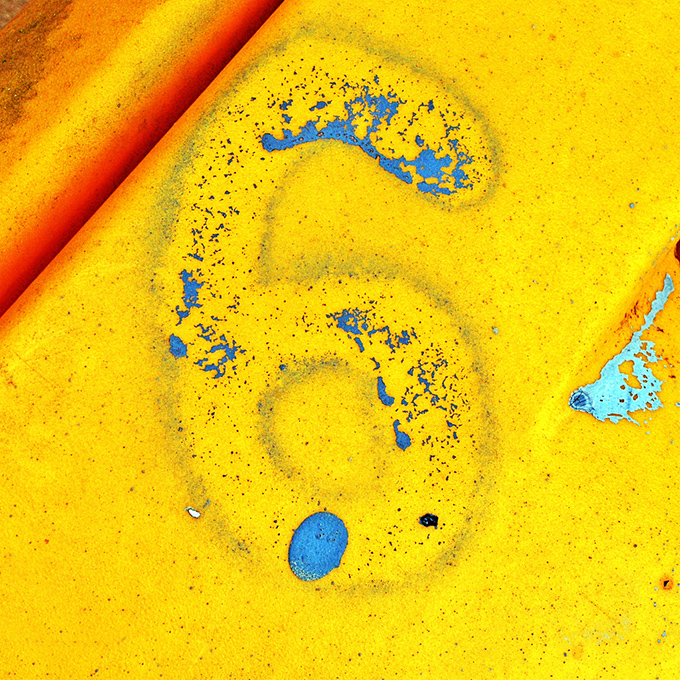 Yellow aged house number