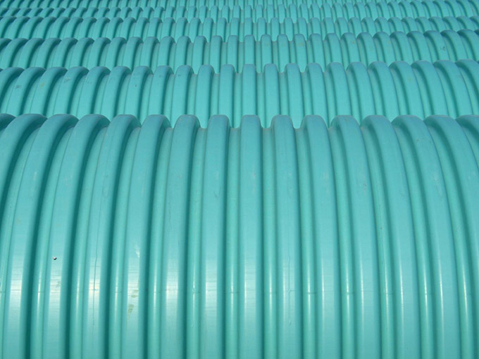 Close up of blue/green plastic barrels