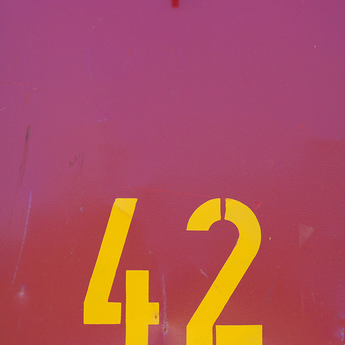 Purple painted metal with the number 42