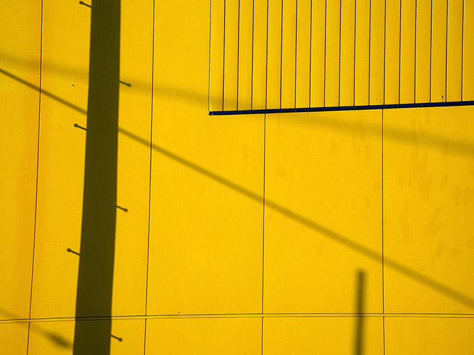 Shadows on a yellow wall