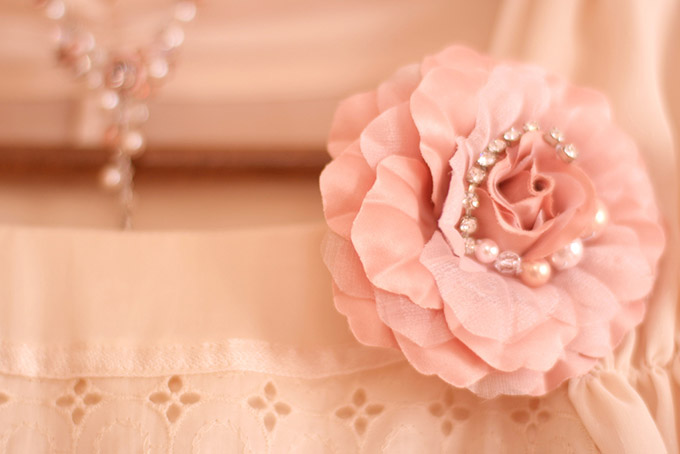 Fabric rose on a lace dress