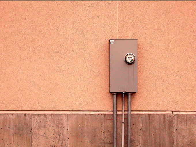 Electrical box on apricot coloured wall